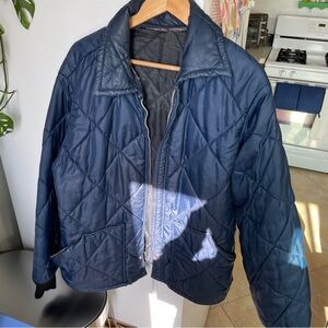 USED waffled nylon jacket is a good lightweight zip up. Sold as is.